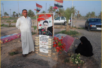 A father and mother mourn the loss of their son who was killed defending the town against ISIS.