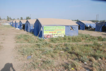 The first photo I took of "tent city" for the internally displaced people who are refugees in their own town.