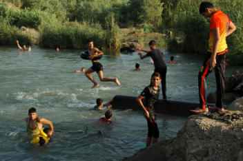 Kids enjoying the relief from the heat