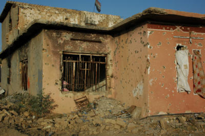 The house destroyed by ISIS still proudly displays the Iraqi national flag.